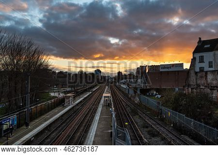 Laken, Brussels Capital Region - Belgium - 01 12 2021 Colorful Clouds Over The Railway Tracks At The