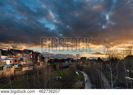 Laken, Brussels Capital Region - Belgium - 01 12 2021 Colorful Clouds Over Tour And Taxis City Park