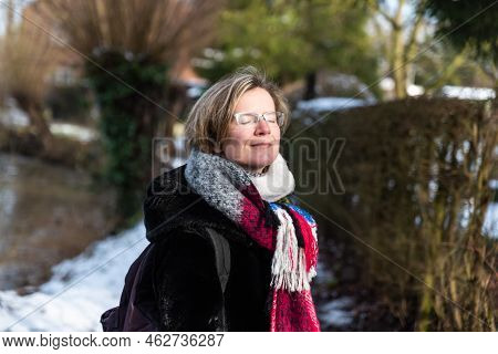 Attractive Thirty Year Old Woman Posing In The Sun During Winter Outdoors, Jodoigne, Belgium