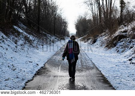 Thirty Year Old Woman Walking At The Ravel Around Jodoigne In The Snow, Belgium
