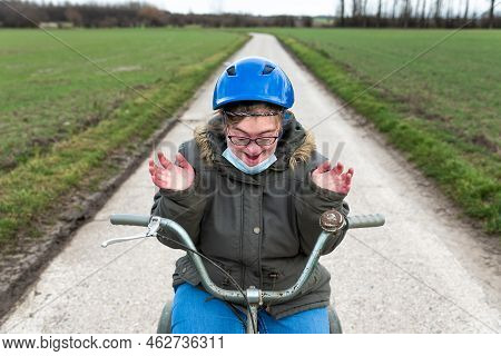 Happy Girl With Blue Helmet  Driving The Tricycle In The Flanders Fields, Hakendover, Belgium