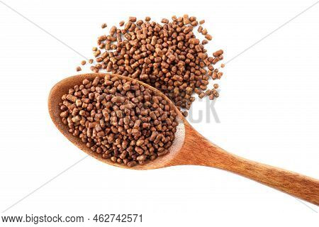 Wooden Spoon With Buckwheat Tea Granules On White Background, Top View
