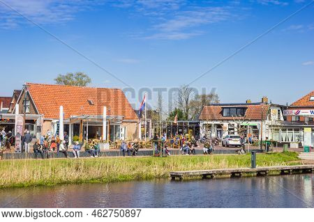 Eernewoude, Netherlands - April 27, 2021: People Enjoyin The Sun At The Canal In Eernewoude, Netherl