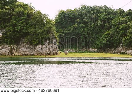 Beautiful Nature Scenic Landscape With Mountain Range Clear View On Blue Sky And Wooden Raft Floatin