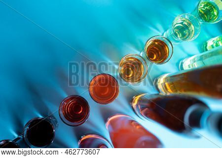 Collection Set Of Colored Alcohol Tincture Or Liquor With Shot Glass And Bottles