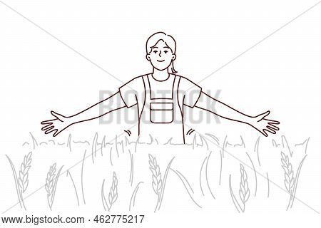Smiling Girl Walking In Field Enjoying Sunny Weather Outdoors. Happy Female In Cropland Or Pasture. 