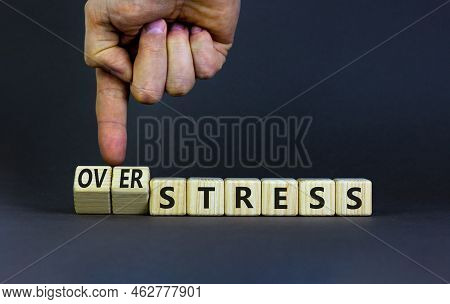 Over Stress Symbol. Psychologist Turns Wooden Cubes And Changes The Concept Word Stress To Over Stre