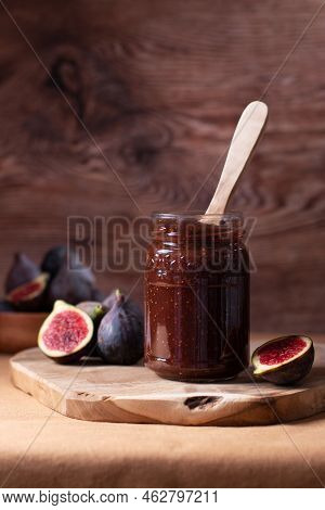Autumn Preserves, Fig Jam Or Fig Marmalade On Wooden Board With Fresh, Ripe Figs, Still Life