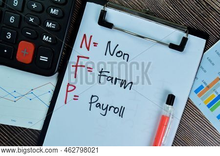 Concept Of Nfp - Non Farm Payroll Write On Paperwork Isolated On Wooden Table.