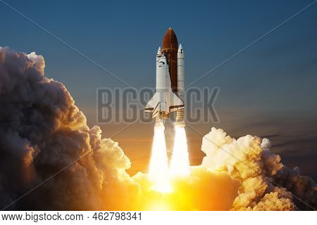 Spaceship Lift Off. Space Shuttle With Smoke And Blast Takes Off Into Space On A Background Of Sunse