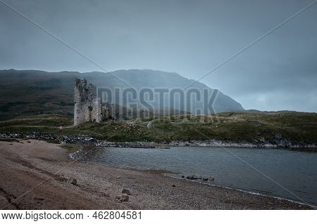 A Old Castle On The Shore Mountain Lake With Rain Clouds. Ardvreck Castle On The Shore Of Loch Assyn