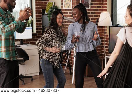 Multiethnic Young Adult Women Couple Dancing, Drinking Alcohol, Wine Accompanied By African American