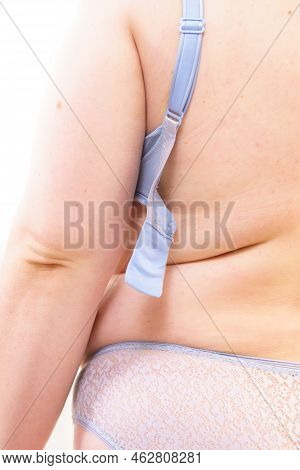 Proper Fitting Bras. Big Woman Opening Taking Off Or Putting On Her Bra. Plus Size Overweight Female