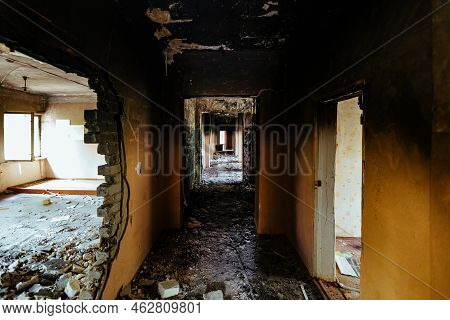 Burnt Building Interior. Ruined Coridor Walls In Black Soot. Consequences Of Fire