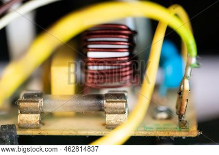 Brown Damaged Fuse That Has Blown And Defective.