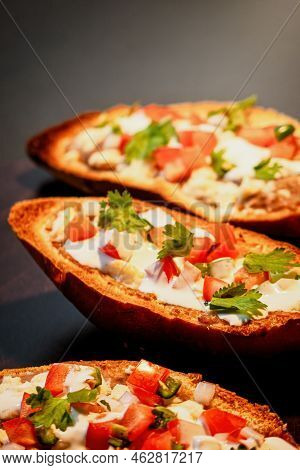 Mexican Molletes, Traditional Food With Bread, Beans, Cheese, Tomato And Chili