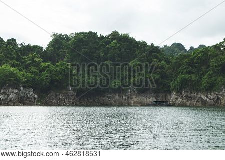 Beautiful Nature Scenic Landscape With Mountain Range Clear View On Blue Sky And Wooden Raft Floatin