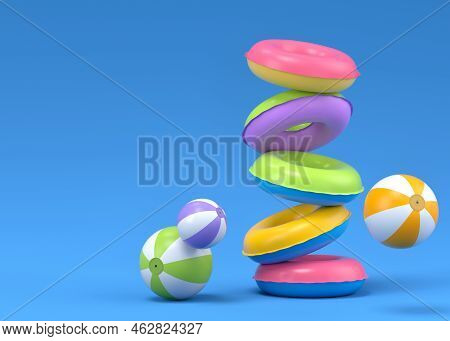 Colorful Inflatable Rings And Balls Flying On Blue Background, Summer Vacation