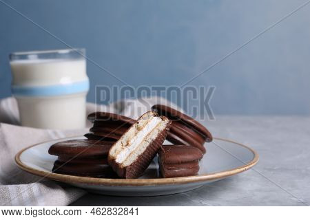 Tasty Choco Pies And Milk On Grey Table