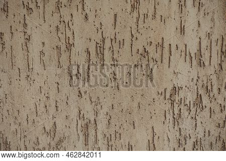 Coarse Surface Of Beige Wall With Stucco Worm Finish