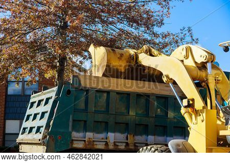 When Autumn Season Approaches, Municipal Workers Remove Fallen Leaves From Ground Near Homes With Bu