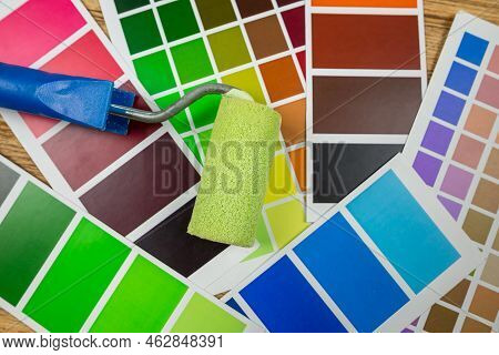 Paint Roller And Color Palette Guide Close-up.color Palette, Paint Swatch Guide, Color Catalogue.