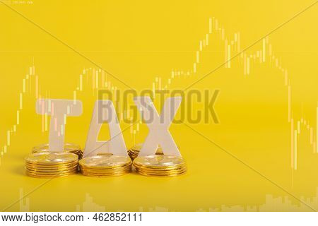 Tax Btc Cryptocurrency With Tax Wording On Bitcoin And Caculator On Stock Graph Yellow Background