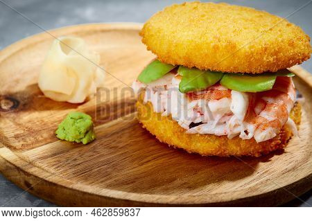 Pan-asian Cuisine Concept. Japanese Sushi Burger Made From Rice Bread, Crab Meat, Avokado And Wasabi