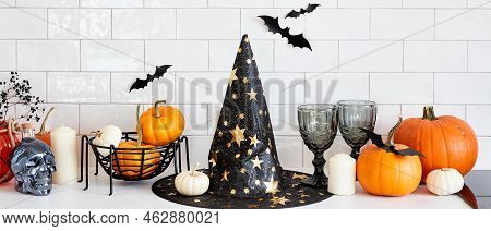 Halloween Banner Design With Witch Hat, Pumpkins, Halloween Decorations On White Table. Halloween Ho