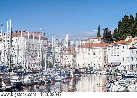 Piran, Slovenia - September 17, 2021: Motor Boats And Sailing Ships Anchored And Parked On Pontoons 