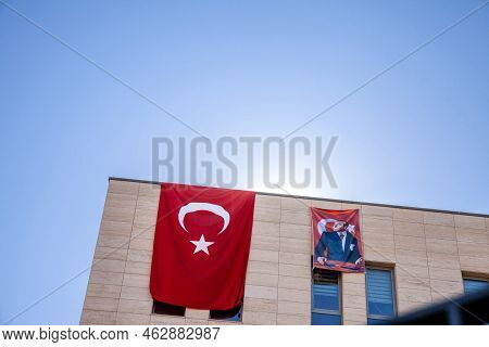 Istanbul, Turkey - May 21, 2022: Flag With The Picture Of Mustafa Kemal Ataturk On A Building Next T