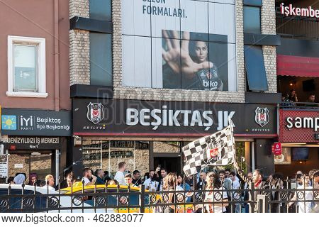 Istanbul, Turkey - May 21, 2022: Group Of Supporters; Footbal Ultras, Passing In Front Of A Logo Of 
