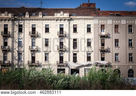 Facade Of A Abandoned Hotel, In Derelict, In Europe, Seen From The Outside, Ready For Renovation And