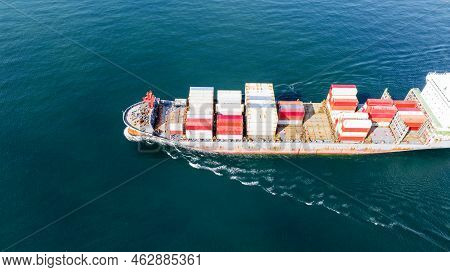 Side Of Cargo Ship Carrying Container And Running