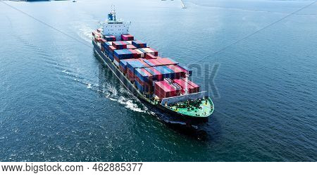 Aerial Front Of Cargo Ship Carrying Container And Running
