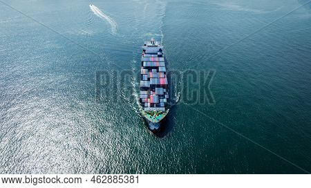 Aerial Front Of Cargo Ship Carrying Container And Running