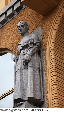 Vaasa, Finland - June 20, 2022: Stone Statue Of Woman, Hanging Above Pharmacy