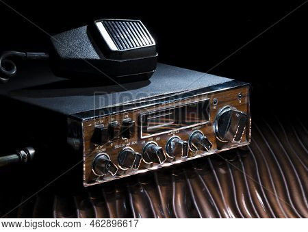 Sideband Cb Radio With Mike On A Wavy Bronze Surface