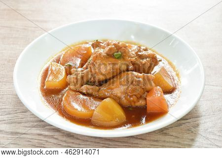 Boiled Chicken Leg With Potato In Swet Red Gravy Sauce Stew On Plate