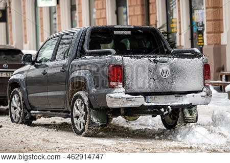 Riga, Latvia, December, 23, 2021: Volkswagen Amarok Parked On Snowy Street, Winter, Daytime, Back Vi