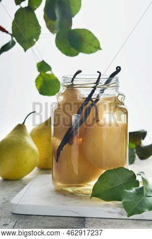 Canned Pear Compote With Vanillin. Pear Compote. Homemade Delicious Canned Pear Compote In Glass Jar