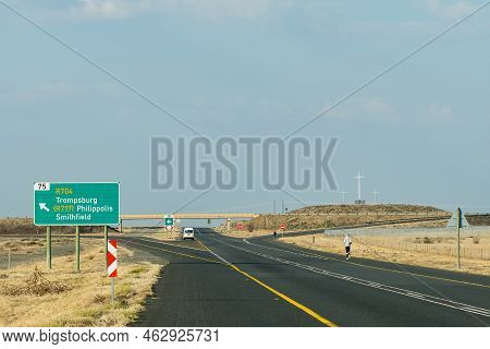 Interchange Between Roads N1 And R717/r704 At Trompsburg. A Directional Sign And Religious Crosses A