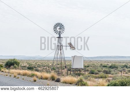 An Old Windmill Next To Road R63 Near Loxton, Used As Solar Panel Platform. Solar Power Is Used To P
