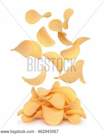 Potato Chips Falling To Potato Chips Heap, On White Background, Levitation Concept Close-up