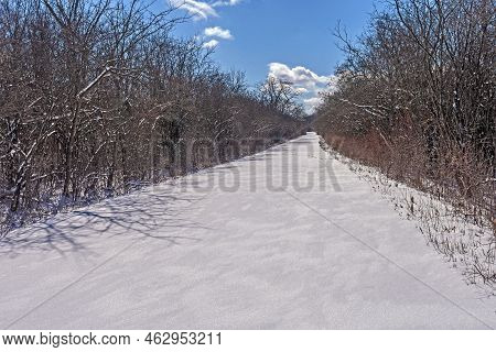 Unbroken Snow On A Rural Road In The Crabtree Nature Center In Illinois