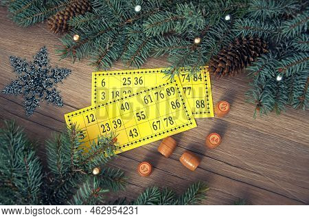 Christmas Background. Christmas Tree Branches, Cones Of A Lotto Card With Numbers And Barrels. Succe