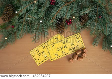 Christmas Background. Christmas Tree Branches, Cones Of A Lotto Card With Numbers And Barrels. Succe