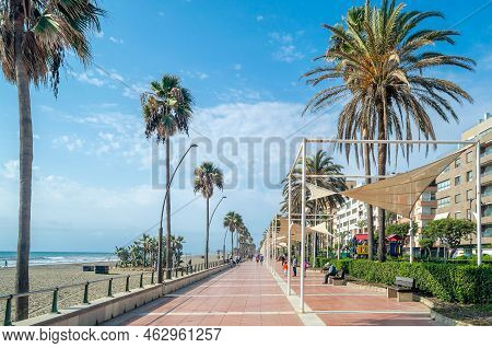 Estepona, Spain - October 12, 2021: People Walking On The Seafront Of Estepona, A Town On The Costa
