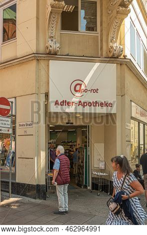 Germany, Lubeck - July 13, 2022: Closeup Of Entrance To Adler Pharmacy On Corner Of Breite And Fleis