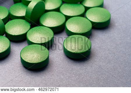 This Macro Shot Of A Green Pill On A Blue Background Is A Great Way To Show Your Customers That They